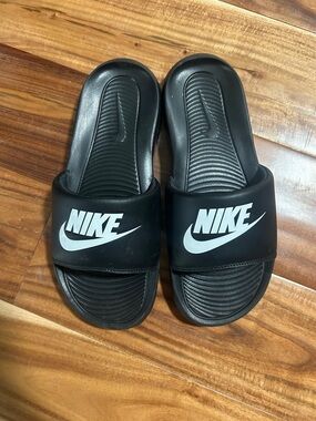 Nike Black Slides with White Swoosh Logo